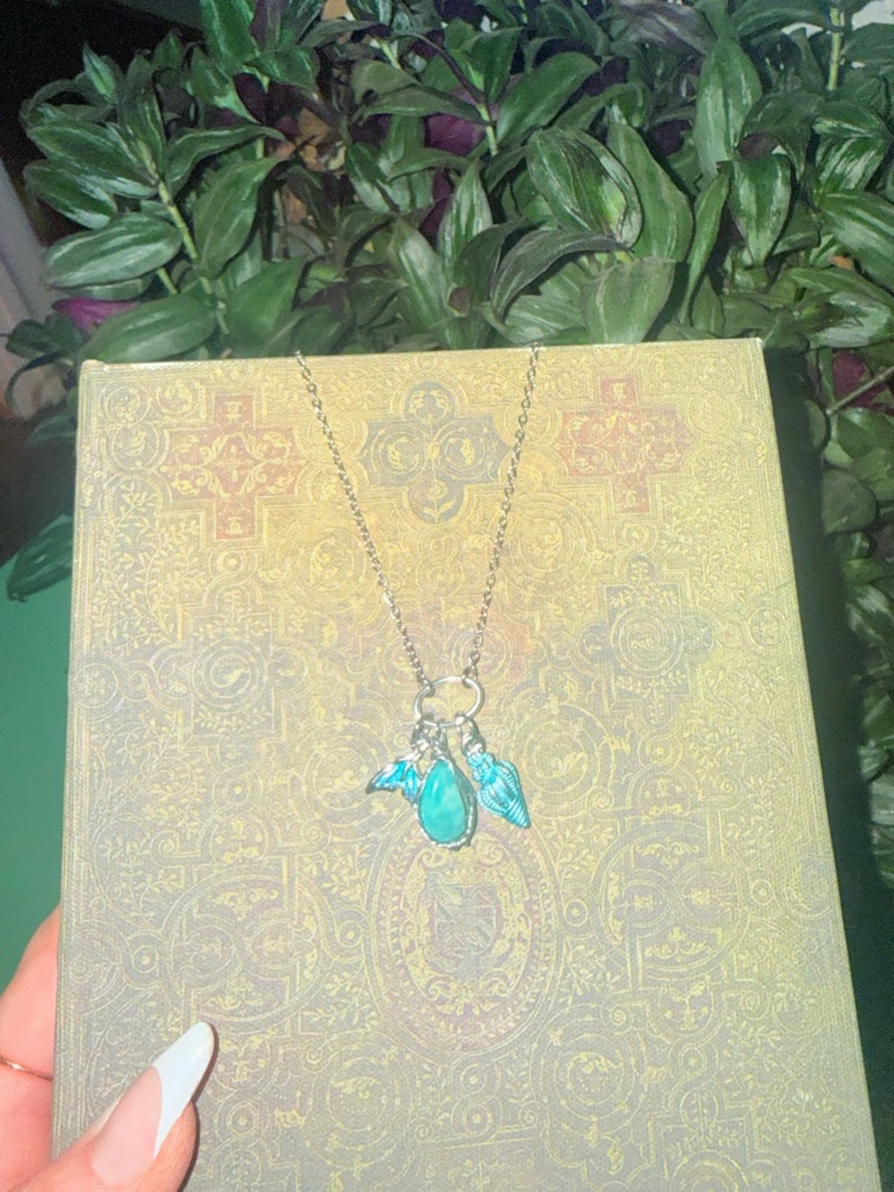 Beach inspired silver charm necklace in show